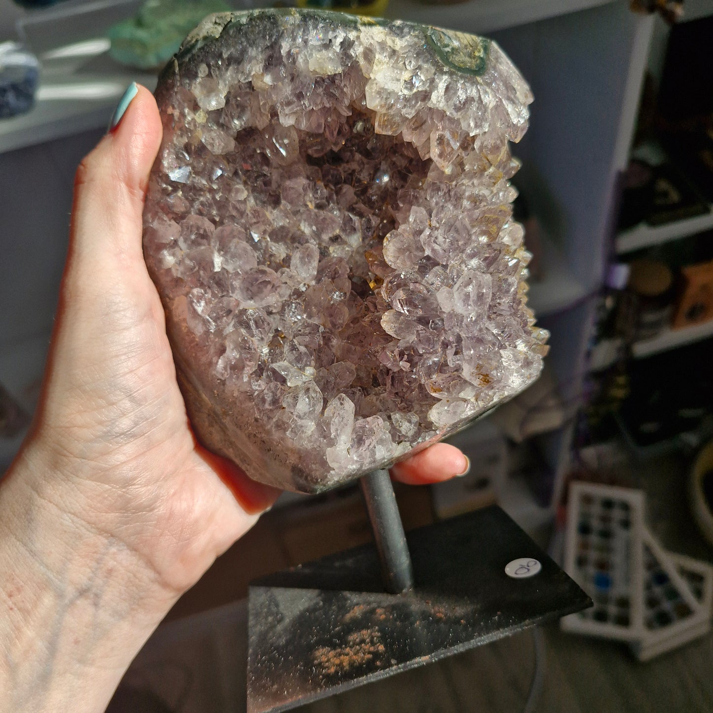 Large amethyst geode on stand