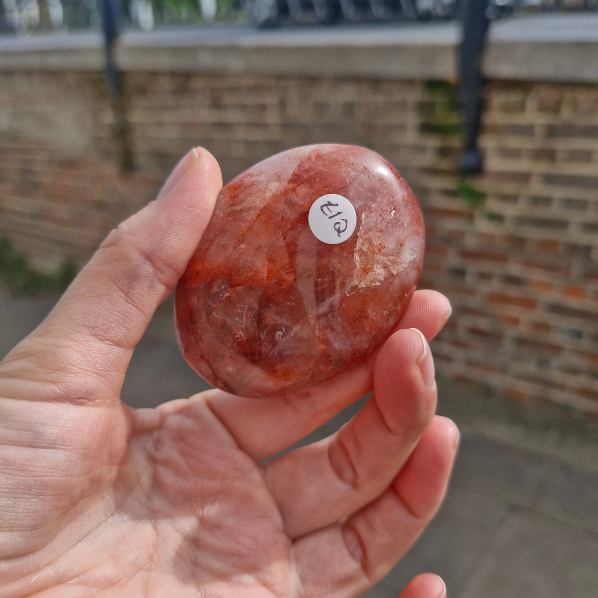 Fire Quartz in Rose Quartz Palm Stone 101g