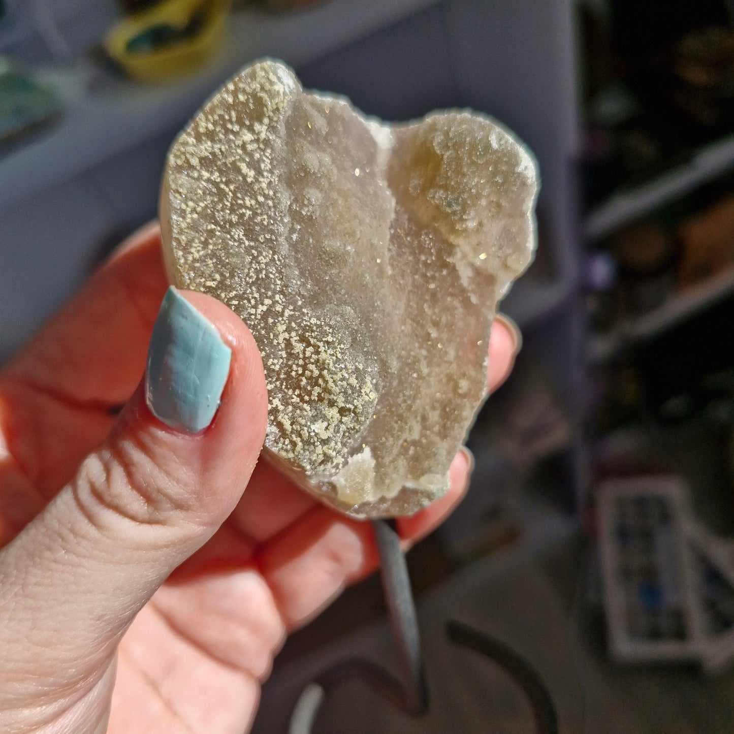 Grey sugary amethyst geode on stand