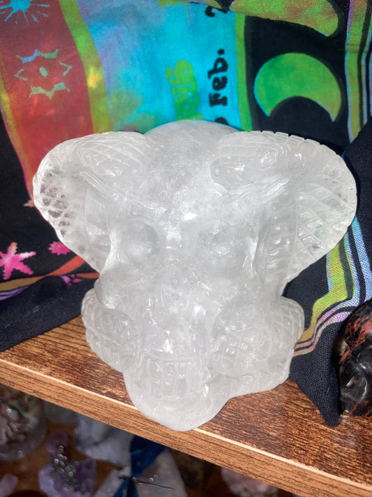 Clear Quartz Skull With Snakes Carving