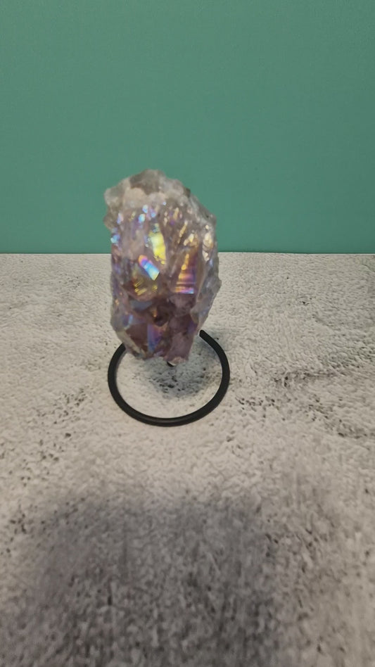 Small aura amethyst geode on stand