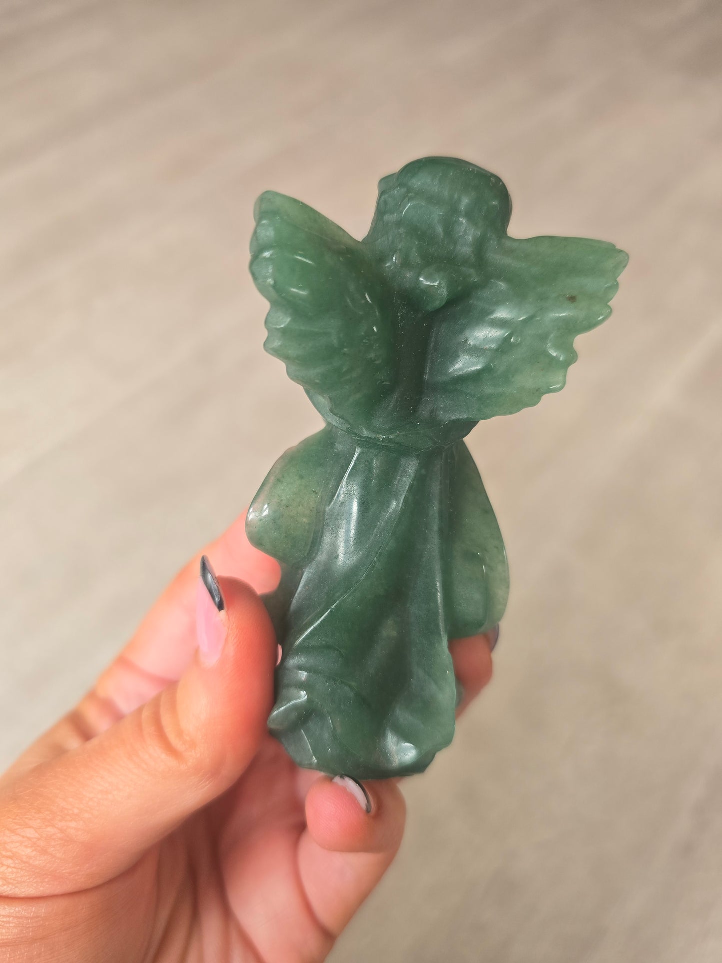 Carved green aventurine angel