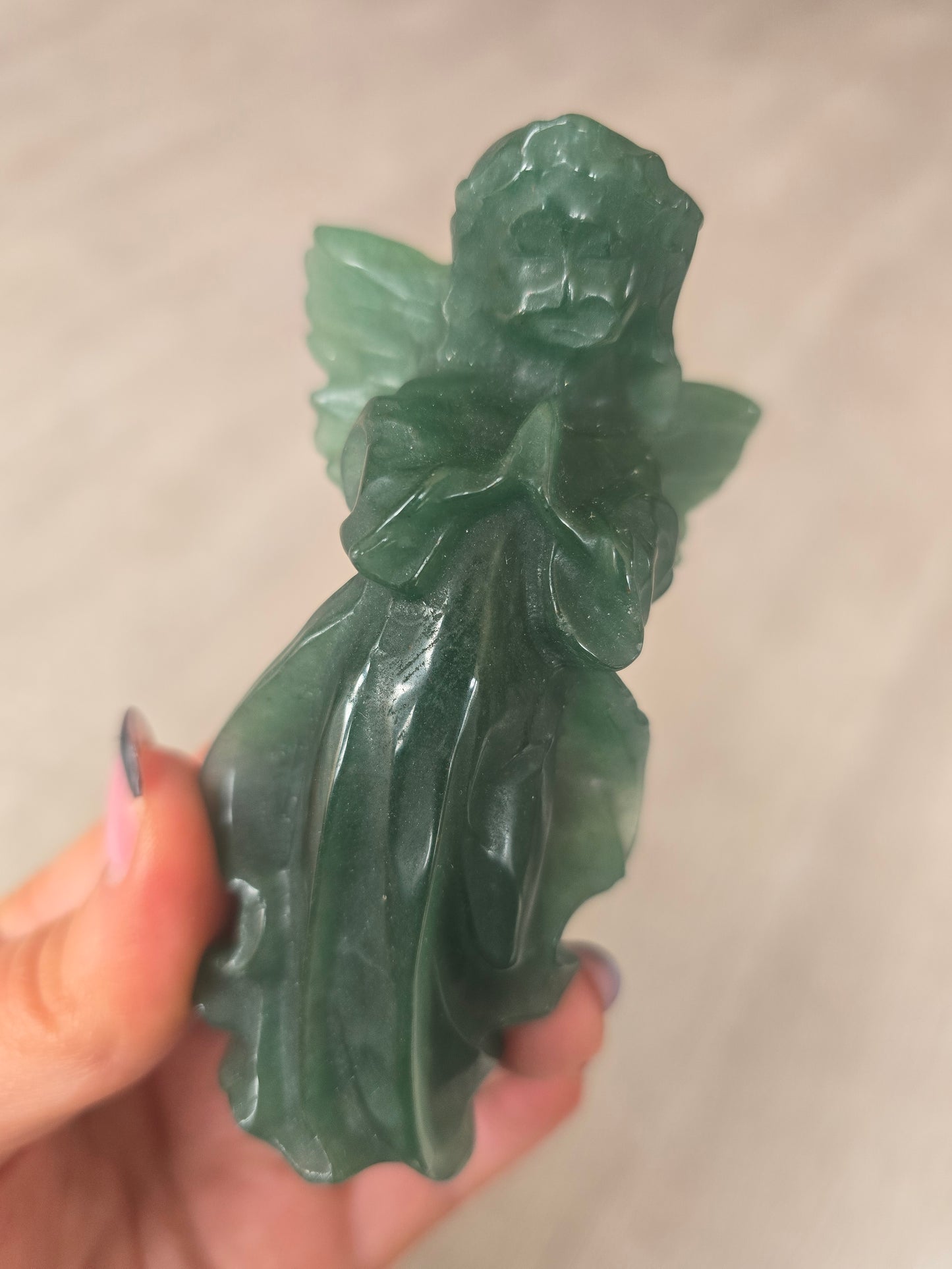 Carved green aventurine angel