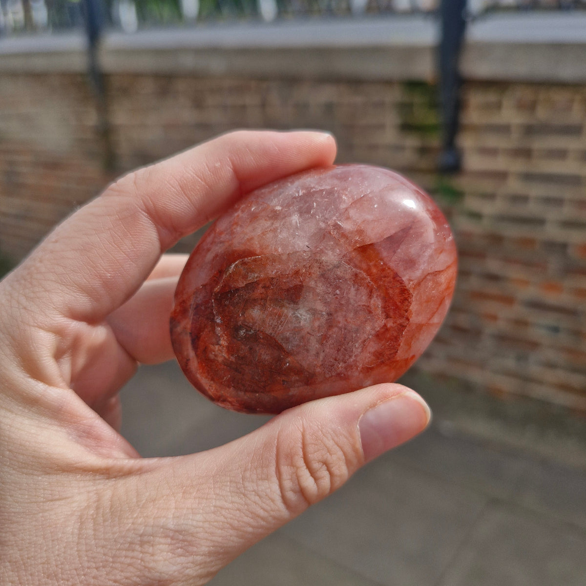 Fire Quartz in Rose Quartz Palm Stone 101g