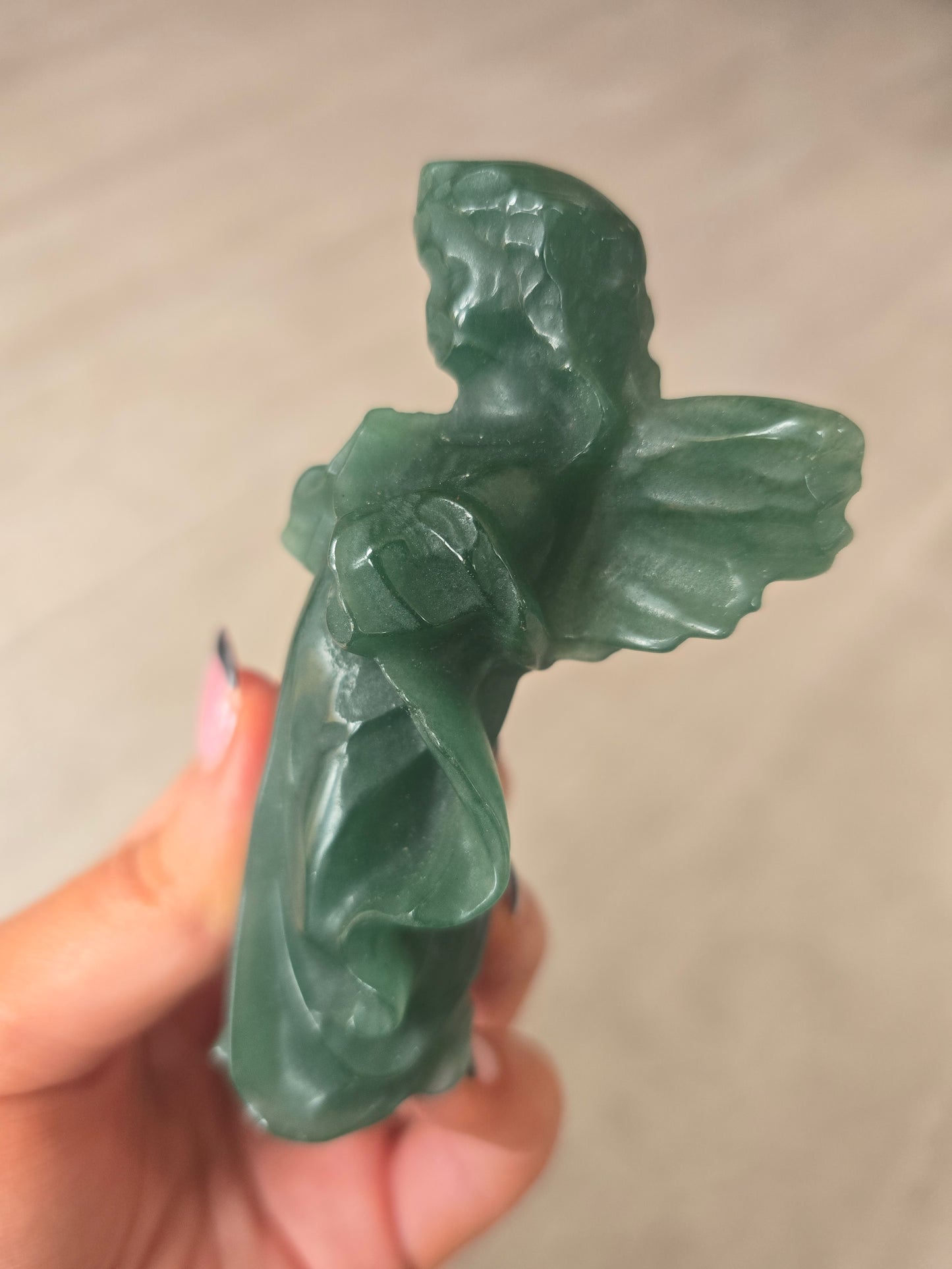 Carved green aventurine angel