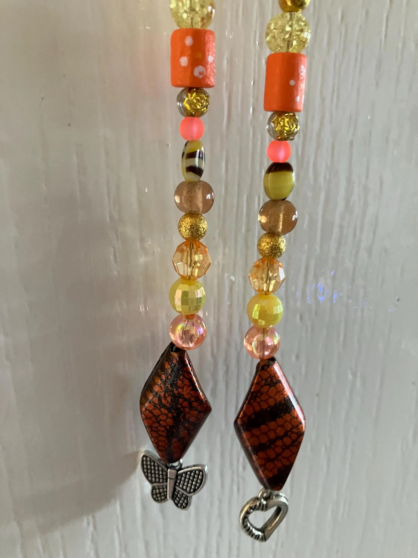 Beautiful handmade sun catchers hanging from a wicker hoop